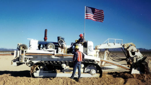 Cool picture of trencher plow with American Flag